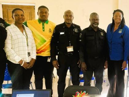 Dr Grace Kelly (right), Northern Caribbean University psychologist, poses with members of the Manchester Police Division after conducting a session on psychological first aid. 