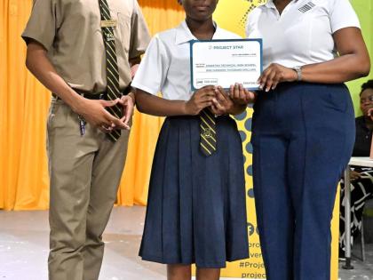 Project STAR Training Coordinator Kelly Griffith (right) presents a certificate representing a $100,000 cash implementation grant to the winning Business Pitch Team Jason Campbell (left) and Nakeida Williamson (centre) from Kingston Technical High School f