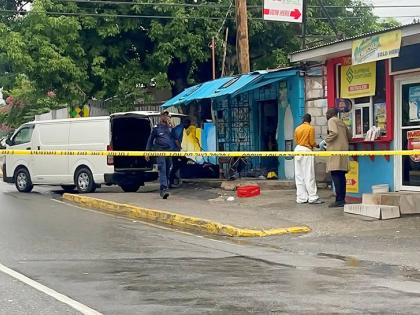 Investigators combing a crime scene following a double murder and shooting in Barbican, St Andrew, in April 2025. 