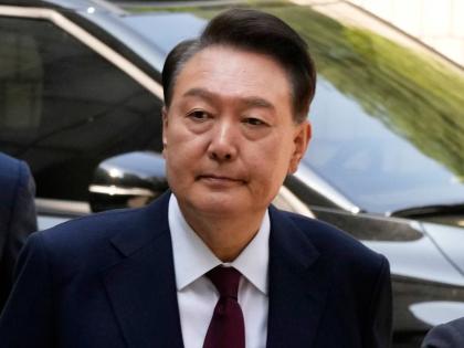 Then South Korea's ousted former President Yoon Suk Yeol who is facing charges of orchestrating a rebellion when he declared martial law on December 3, arrives to attend his trial at the Seoul Central District Court in Seoul, South Korea on May 12, 2025.