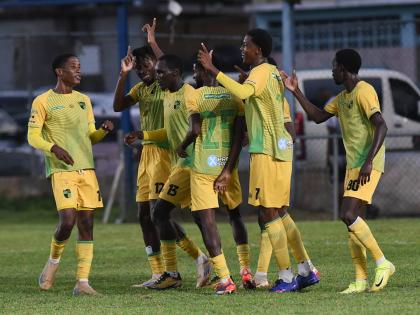 Treasure Beach FC players celebrate a goal against Molynes United during their Jamaica Premier League football match at he Drewsland stadium on Sunday.