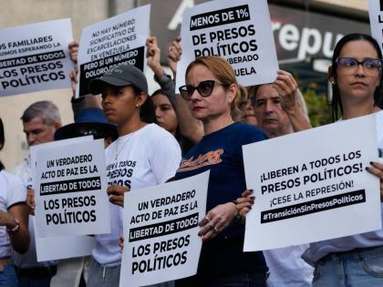 Relatives and friends of political prisoners hold banners calling for their loved ones to be set free outside El Helicoide, the headquarters of Venezuela’s intelligence service and detention centre, in Caracas.