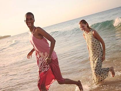 Shot in the lapping surf of the Dominican Republic, The Rock’s Tami Williams (left) wears the pink embroidered coral Millay dress from Tuckernuck’s Resort 2026 collection. Her American model peer Paige Reifler is in a fern lace crochet Leilana dres