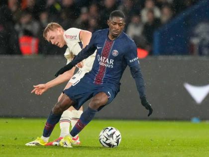 PSG’s Ousmane Dembele (right) turms away from Lille’s Hakon Arnar Haraldsson during the French League One  match between Paris Saint-Germain and Lille in Paris, France, yesterday.