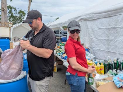 Belizeans organising care-packages on a Bluefields Bay Villas property in Westmoreland for delivery.
