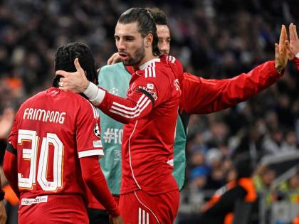 Liverpool’s Jeremie Frimpong (left) and teammate Dominik Szoboszlai celebrate after Marseille’s goalkeeper Geronimo Rulli scored an own goal during a Champions League opening phase football match in Marseille, France yesterday.