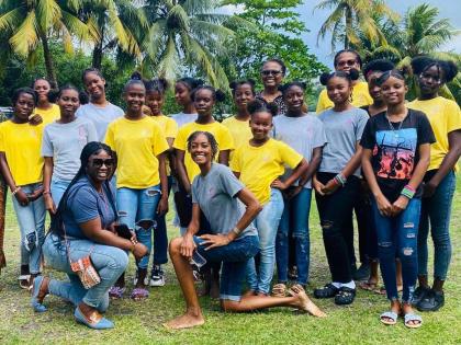 Some of the participants in the Girls Becoming Mentoring Programme with their mentors.