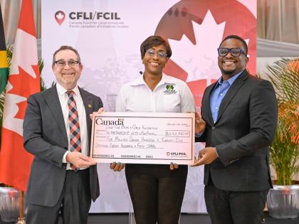 Patron of the Save our Boys and Girls Foundation and Member of Parliament for St Andrew East Rural, Juliet Holness (centre), and EduFocal co-founder and Chief Executive Officer (CEO), Gordon Swaby (right), receive a cheque from High Commissioner of Canada 
