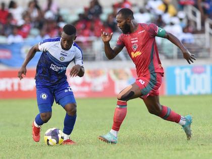 Montego Bay United Football Club’s captain Owayne Gordon (right) moves in to tackle Franco Celestin of Mount Pleasant Football Academy during their Jamaica Premier League football semi-final at Sabina Park on Sunday, May 18, 2025.