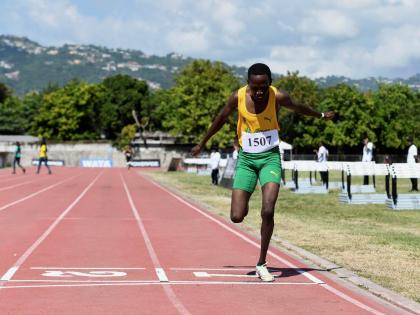 Ryan Achau of St Jago High School comes home a lonely winner in the Class One boys’ 1500 metres at the McKenley/Wint Invitational Meet at Calabar High School last year.