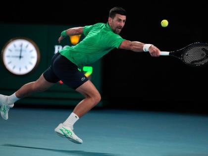 Novak Djokovic of Serbia plays a backhand return to Botic van de Zandschulp of the Netherlands during their third round match at the Australian Open tennis championship in Melbourne, Australia on January 24, 2026. 