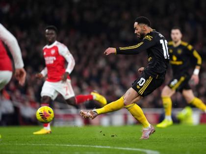 Manchester United’s Matheus Cunha scores his side’s third goal during the English Premier League match between Arsenal and Manchester United in London yesterday.