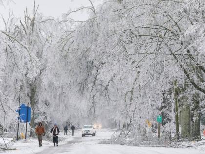 In this image provided by the City of Oxford, Miss., snow and ice cover trees and streets as a winter storm passes through on January 25, 2026, in Oxford, Mississippi. 