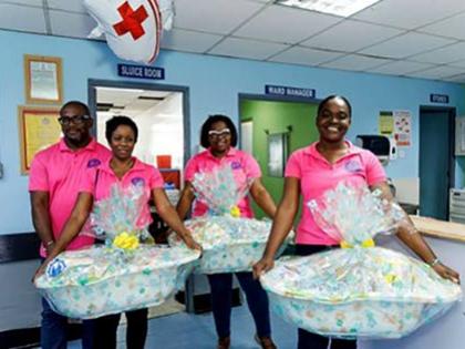 JDF Credit Union staff prepare to deliver care baskets at the Victoria Jubilee Hospital, providing practical support to first-time mothers for Mother’s Day.