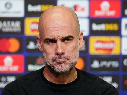 Manchester City manager Pep Guardiola looks on during a press conference in Manchester, England yesterday, one day ahead of their Champions League football match against Galatasaray. 
