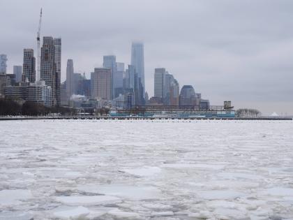 Clouds cover the top of One World Trade, top centre, as ice crowds the Hudson River in New York, Monday, January 26, 2026. (AP Photo/Seth Wenig)