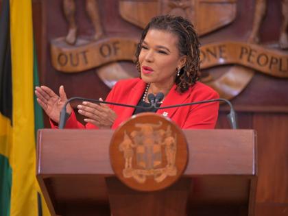 Minister without Portfolio in the Office of the Prime Minister with Responsibility for Efficiency, Innovation and Digital Transformation, Ambassador, Audrey Marks, addresses the ceremony for the official launch of the implementation of the flexible work ar