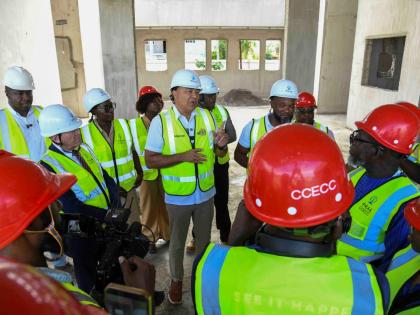 Dr Christopher Tufton, Minister of Health and Wellness speaks with the media after touring the Greater Portmore Health Centre on Wednesday.