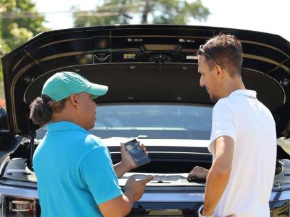 Attendees take a closer look at the BYD Shark, exploring the hybrid pickup’s functionality and technology during the BYD Test Drive Day at the Police Officers’ Club.