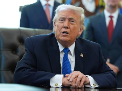 President Donald Trump speaks during an event in the Oval Office of the White House, Friday, January 30, 2026, in Washington. (AP Photo/Evan Vucci)