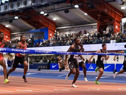 Jamaica’s Ackeem Blake (centre) wins the men’s 60 metres in 6.55 seconds at the Millrose Games in New York yesterday.