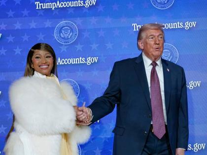 Nicki Minaj and US President Donald Trump stand on stage together during an event for ‘Trump Accounts’ at Carnegie Mellon Auditorium, in Washington DC. 