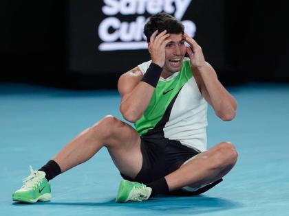 Carlos Alcaraz of Spain celebrates after defeating Novak Djokovic of Serbia in the men’s singles final at the Australian Open tennis championship in Melbourne, Australia, on Sunday.