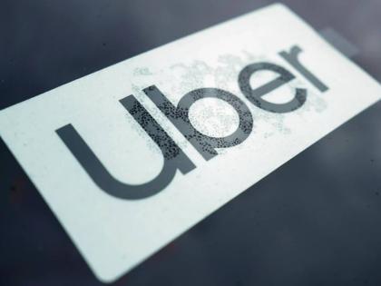 An Uber sign displayed inside a car in Palatine, Ill, February 10,2022. 