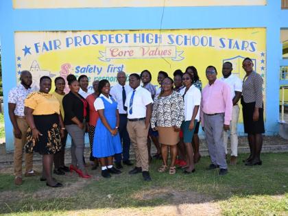 Staff and students at the Fair Prospect High School in Portland pose for a photo. 