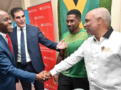 John P Azar (second left), president of Tennis Jamaica, chats with (from left), Peter Mohan, Scotiabank AICB manager, sponsor; Daminic Pagon, captain of the Jamaica Team; and Christopher Samuda, president of Jamaica Olympic Association, at the Davis Cup la
