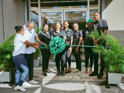 From left: Abbi-Gaye Phillipps, co-founder and managing director, and Krishna Phillipps, co-founder and director, cut the ribbon during the opening of Organica Whole Foods Store’s new Montego Bay location in St James. They are joined by team members (fro