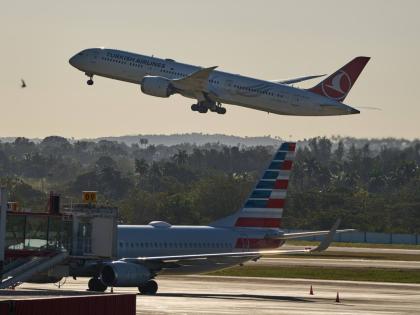 A Turkish Airlines plane takes off alongside an American Airlines plane at Jose Marti International Airport in Havana, Cuba on February 9, 2026.