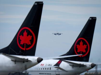 Air Canada aircraft sit parked at Vancouver International Airport in Richmond, British Columbia, August 18, 2025. (Darryl Dyck/The Canadian Press via AP, file)