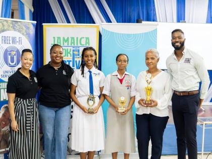 Jamaica Book Festival Director Latoya West-Blackwood (2nd left), along with members of the Jamaica Book Festival team - prize coordinator Stephanie Koathes (left) and marketing director Joel Nomdarkham (right), share a moment with poetry awardees (from lef