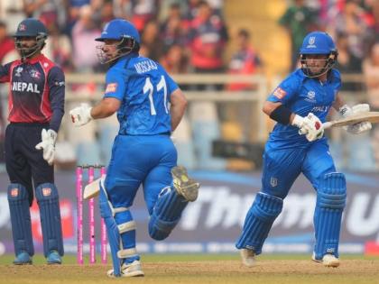 Italy’s Anthony Mosca (left) and Justin Mosca run between the wickets as they bat during the T20 World Cup cricket match between Italy and Nepal in Mumbai, India, yesterday.