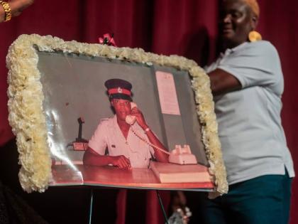 Portrait of Woman Constable Pamella Johnston being unveiled by sister Denise Johnston.