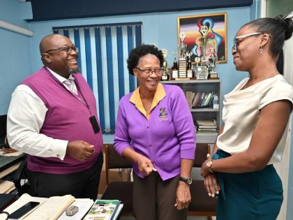 From left: Pembroke Hall High School Principal Reverend Claude Ellis; Vice-Principal of Human Resources and Operation Yvette Shields-Green and Stacy-Ann McIntosh-Richard engage in a conversation. 