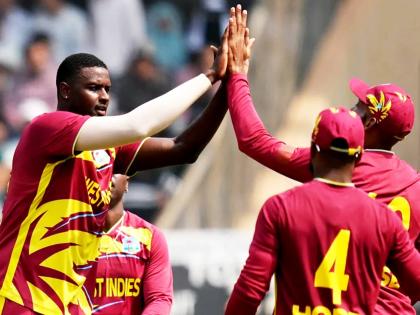 West Indies’ Jason Holder (second left) celebrates with teammates after taking the wicket of Nepal’s Aarif Sheikh (not in photo) during a T20 World Cup cricket match in Mumbai, India on February 15.