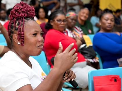 Iasha Johnson, a resident of May Pen, makes a point during a recent town hall meeting in her community organised by Project STAR.
