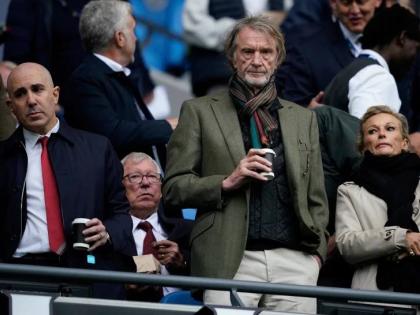 Manchester United co-owner Jim Ratcliffe stands in front of the former manager Alex Ferguson during the English Premier League match between Manchester City and Manchester United in Manchester, England, on September 14, 2025.