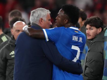 Real Madrid’s Vinicius Junior (right) argues with Benfica’s head coach José Mourinho after scoring the opening goal during a Champions League playoff match between SL Benfica and Real Madrid in Lisbon, Portugal, Tuesday, February 17, 2026. 