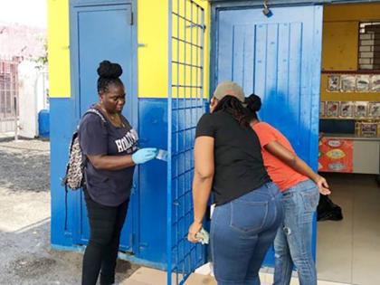 PWD Co-operative Credit Union team members in action, painting the exterior of Bethany Early Childhood Development Centre on December 30, 2025, following the credit union’s adoption of the school.