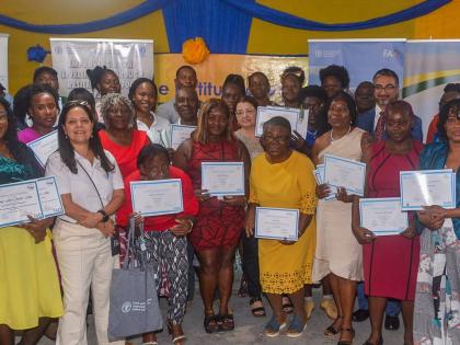 Participants in the FAO’S Improving Rural Livelihoods Through Resilient Agrifood Development initiative show off their certificates during Monday’s graduation.