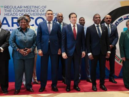 US Secretary of State Marco Rubio (centre front, in red tie), poses for a group photo with other government officials attending the Caribbean Community meeting in Basseterre, Saint Kitts and Nevis, on Wednesday, February 25, 2026. Also pictured are Bahamas