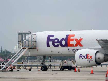 A FedEx cargo plane is shown on the tarmac at Fort Lauderdale-Hollywood International Airport, Tuesday, April 20, 2021, in Fort Lauderdale, Fla. (AP Photo/Wilfredo Lee, File)