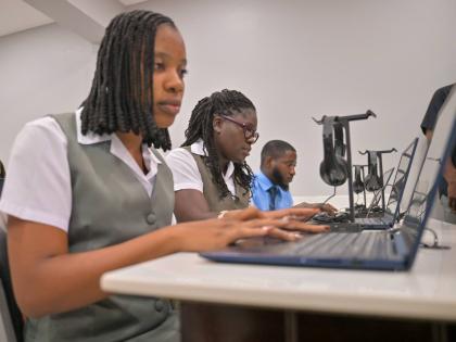 Students at Church Teachers’ College participate in an activity using laptop computers inside the Manchester-based institution’s newly opened smart lab. 