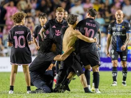 A fan (centre) got onto the field and grabbed Inter Miami’s Lionel Messi during an international friendly  match against Ecuador’s Independiente del Valle in Bayamon, Puerto Rico, on Thursday night.