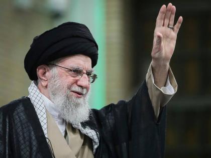 In this photo released by the official website of the office of the Iranian supreme leader, Supreme Leader Ayatollah Ali Khamenei waves to the crowd during his meeting with a large group of laborers in Tehran, Iran, May 10, 2025. 