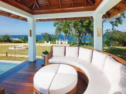 
One of two poolside gazebos, featuring stunning custom furniture.