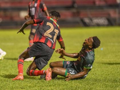 Arnett Gardens Jeremy Nelson (left) leaves Montego Bay United’s Richardo Ramsey in a spot of bother after a challenge in a Jamaica Premier League football game at the Anthony Spaulding Sports Complex on December 15, 2025. 